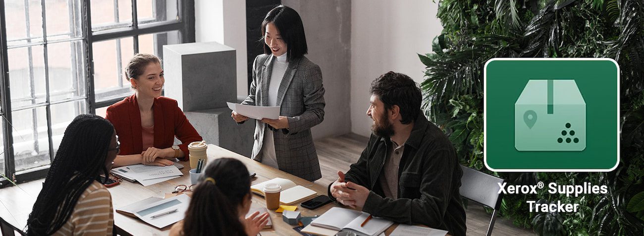 Picture meeting and logo Xerox Supplies tracker Picture of staff meeting with Xerox Supplies tracker logo